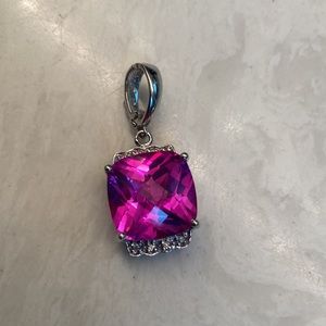 11.81 carat pink topaz pendant in 14kt white gold setting with 8 diamond chips